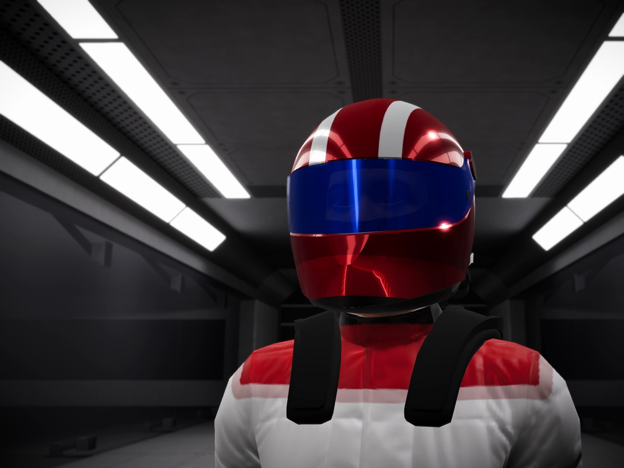 A driver in a red and white race suit wearing a red and white helmet with a blue visor.